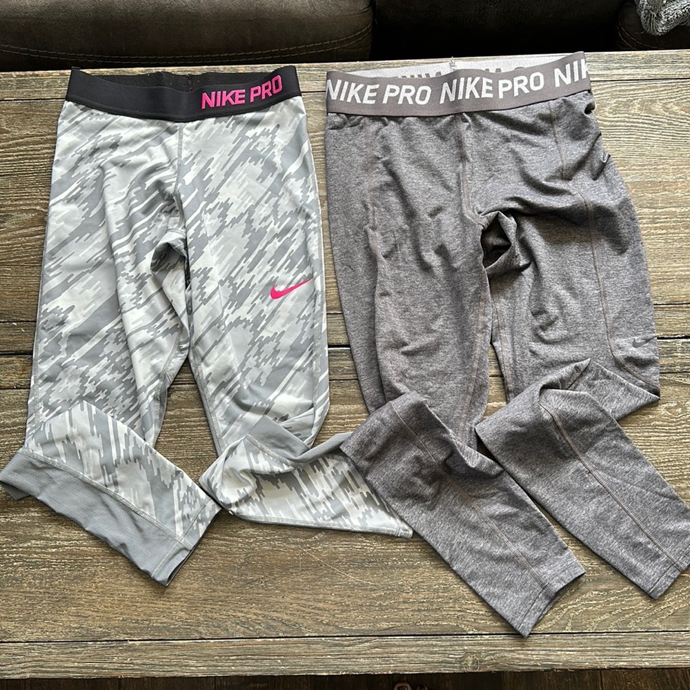 Two pairs girls/women’s Nike pro leggings.